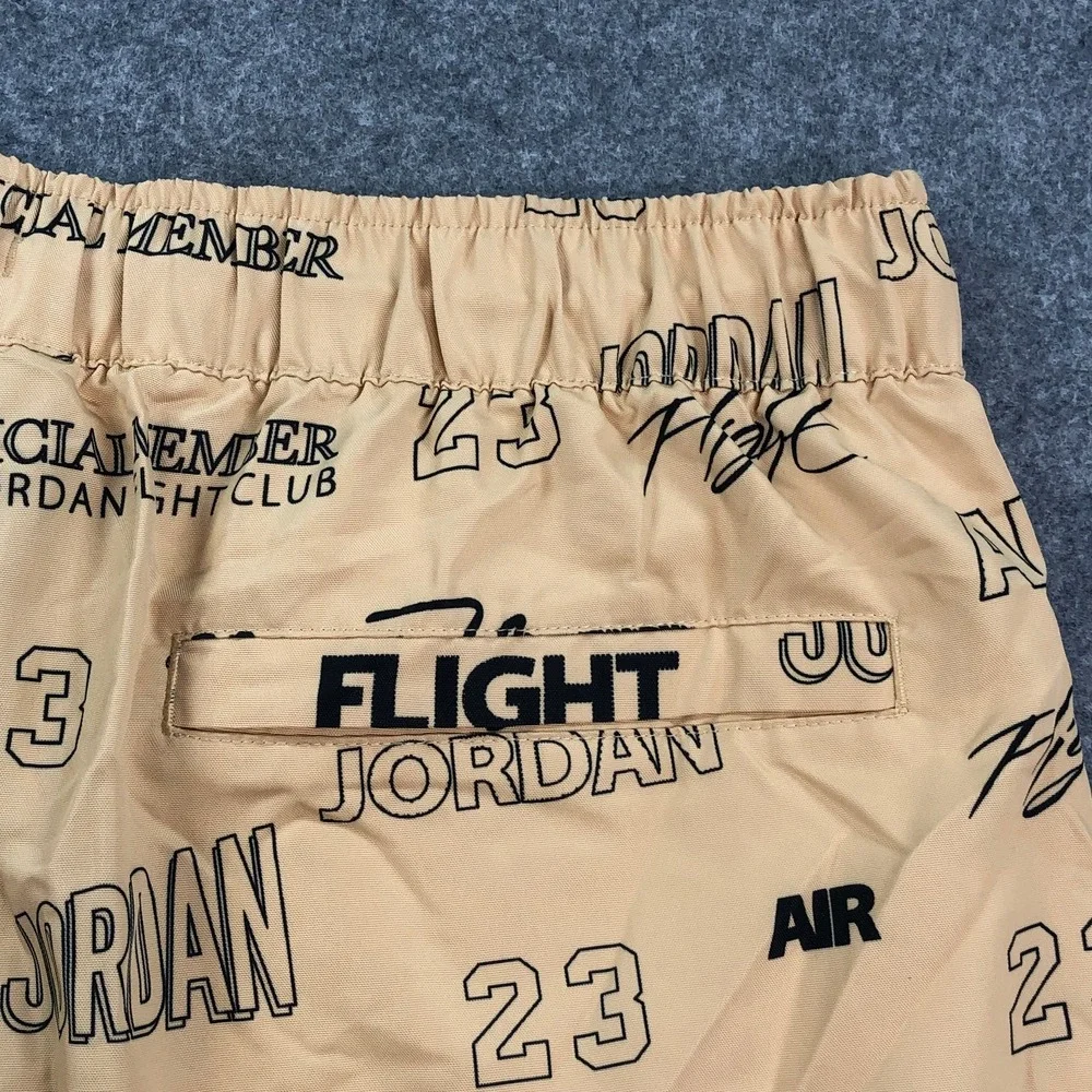 Jordan Mens Flight Club Shorts Medium Tan All-Over Print Graphic Drawstring